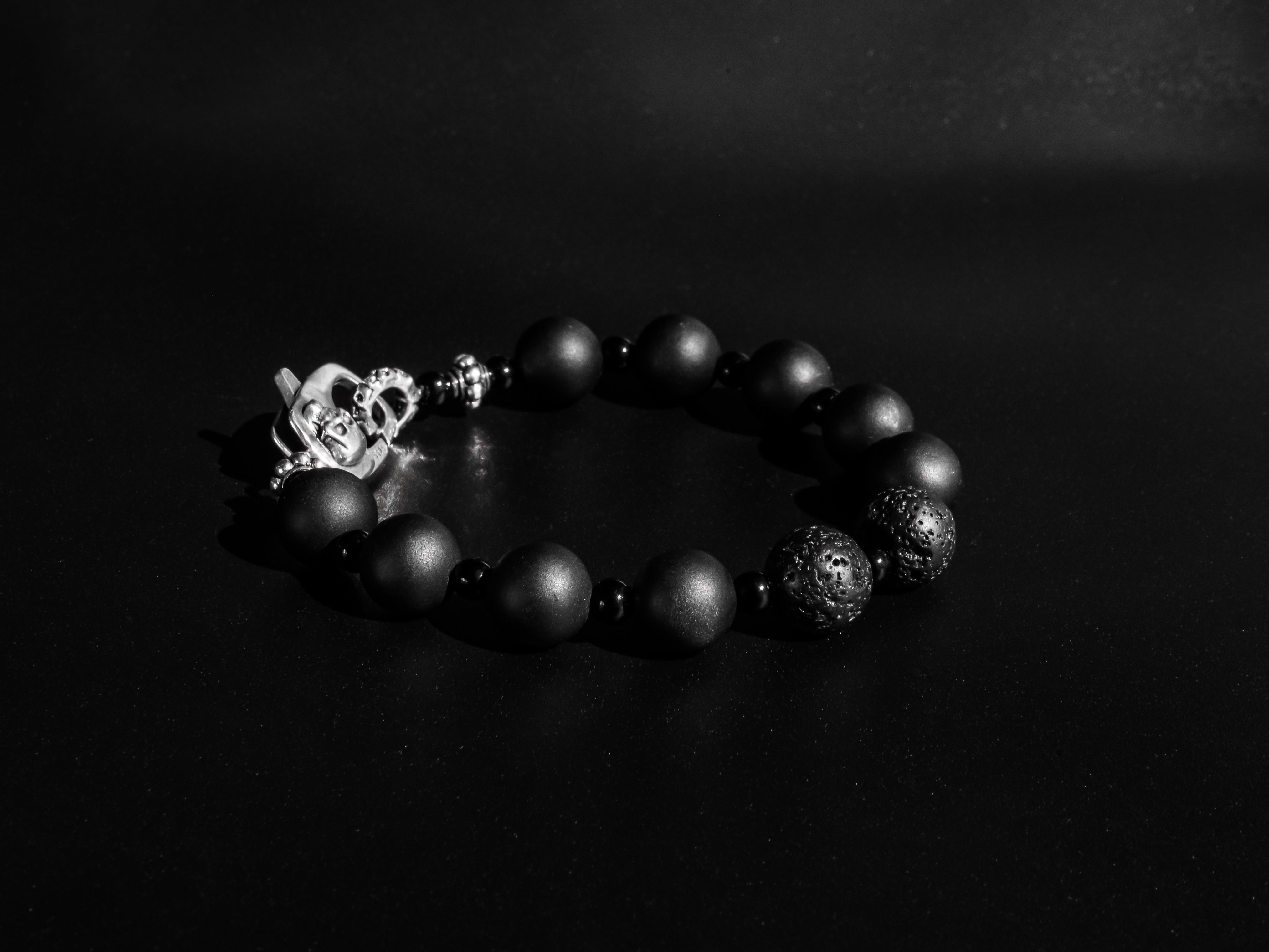 RIVER STYX COLLECTION - MATTE BLACK ONYX AND LAVA STONE BRACELET WITH SILVER SKULL CLASP