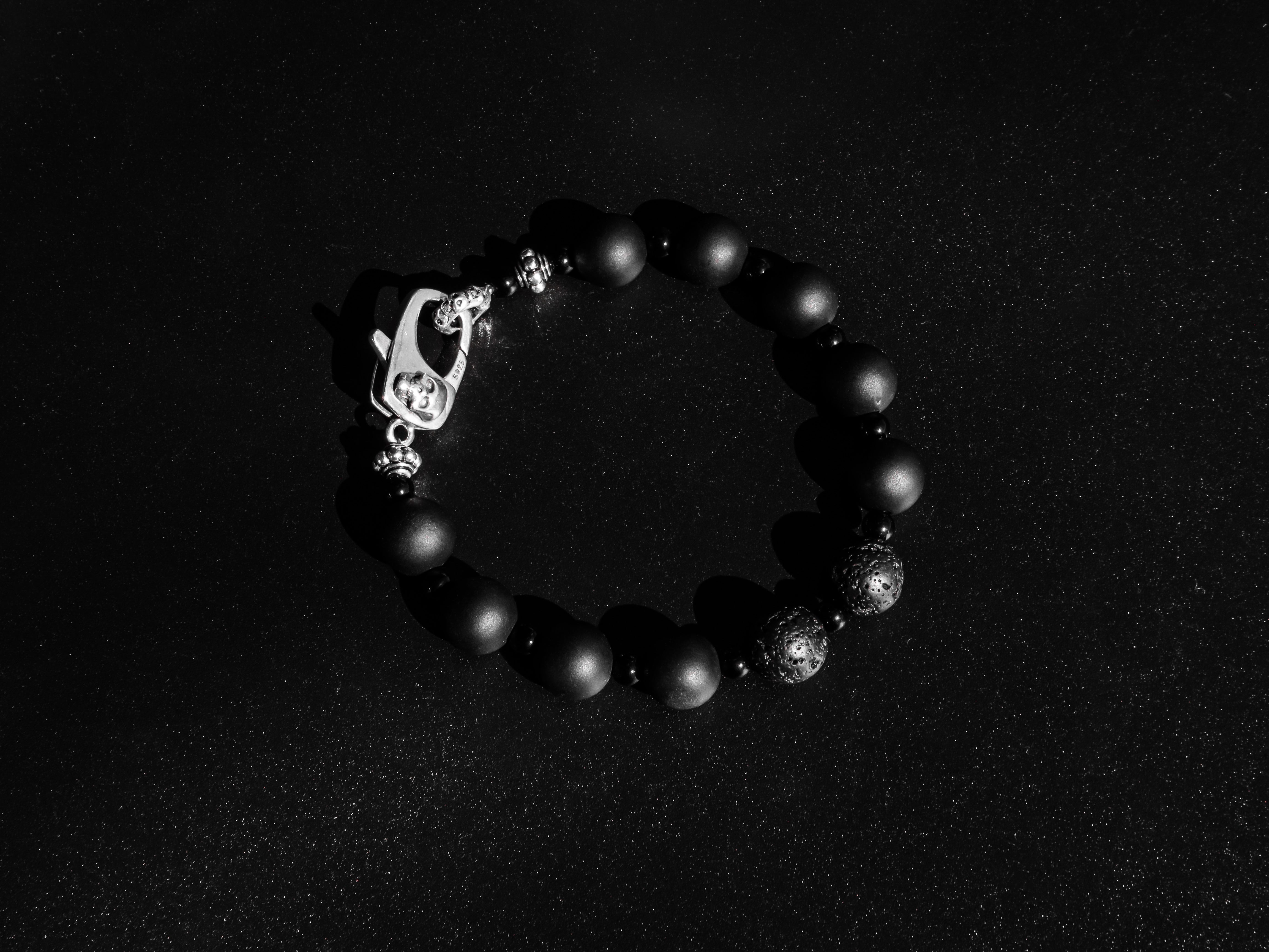RIVER STYX COLLECTION - MATTE BLACK ONYX AND LAVA STONE BRACELET WITH SILVER SKULL CLASP