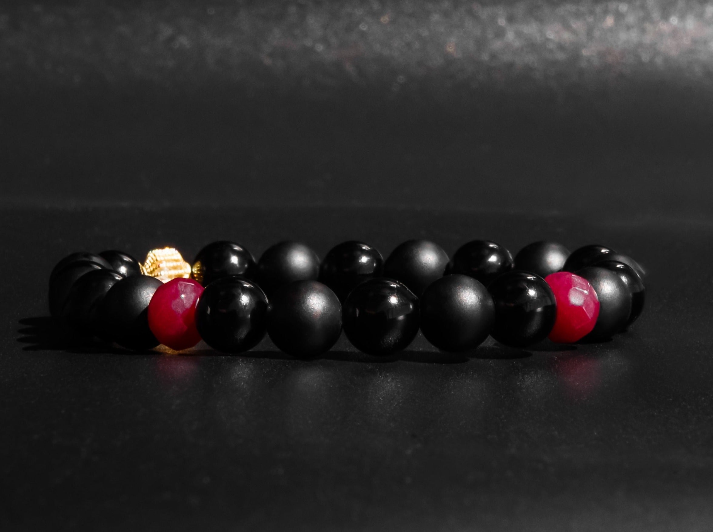 Polshied Onyx and Matte Onyx bracelet accented with Rubies and Gold