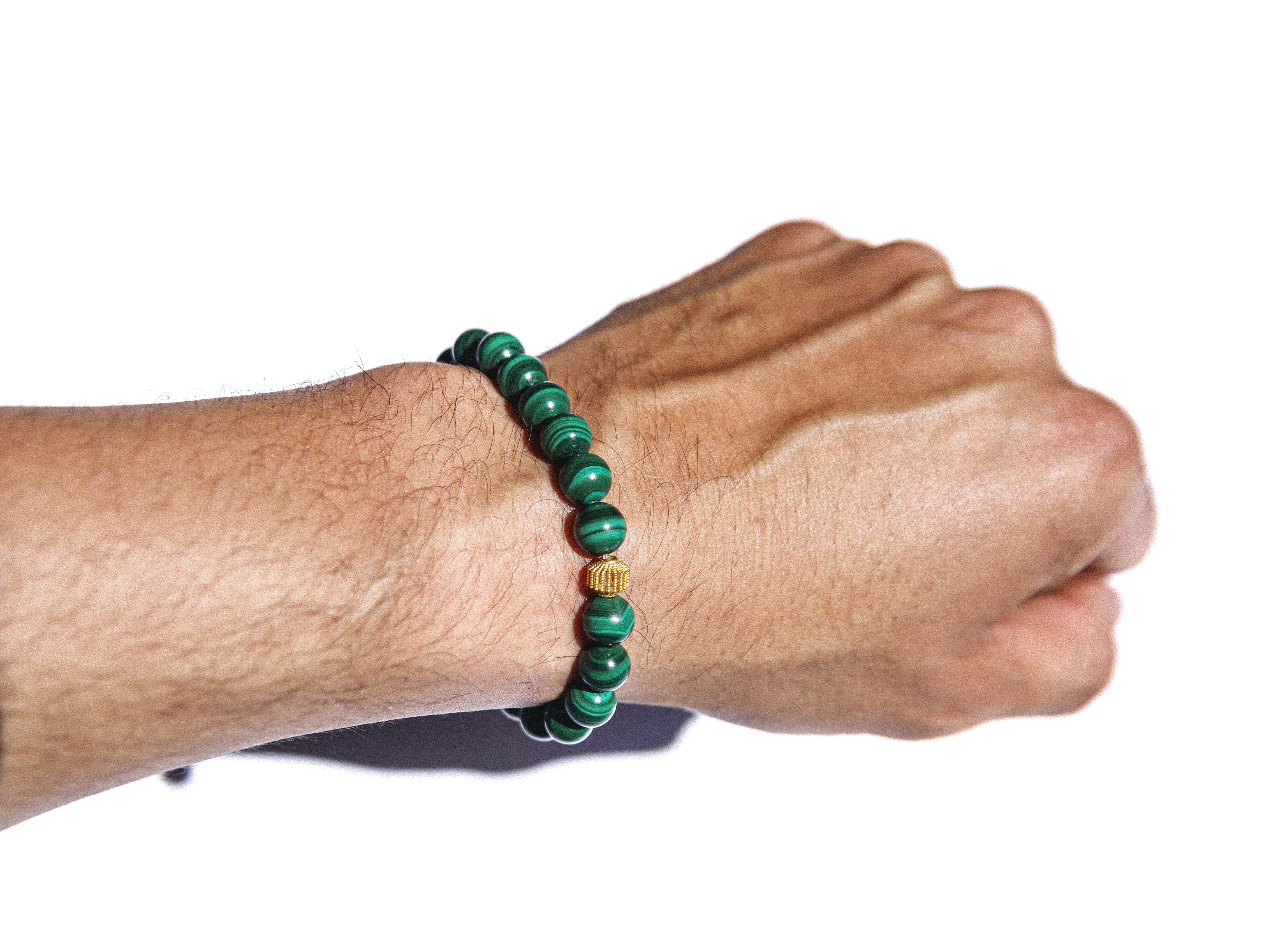 Malachite enclosed in 18k Gold